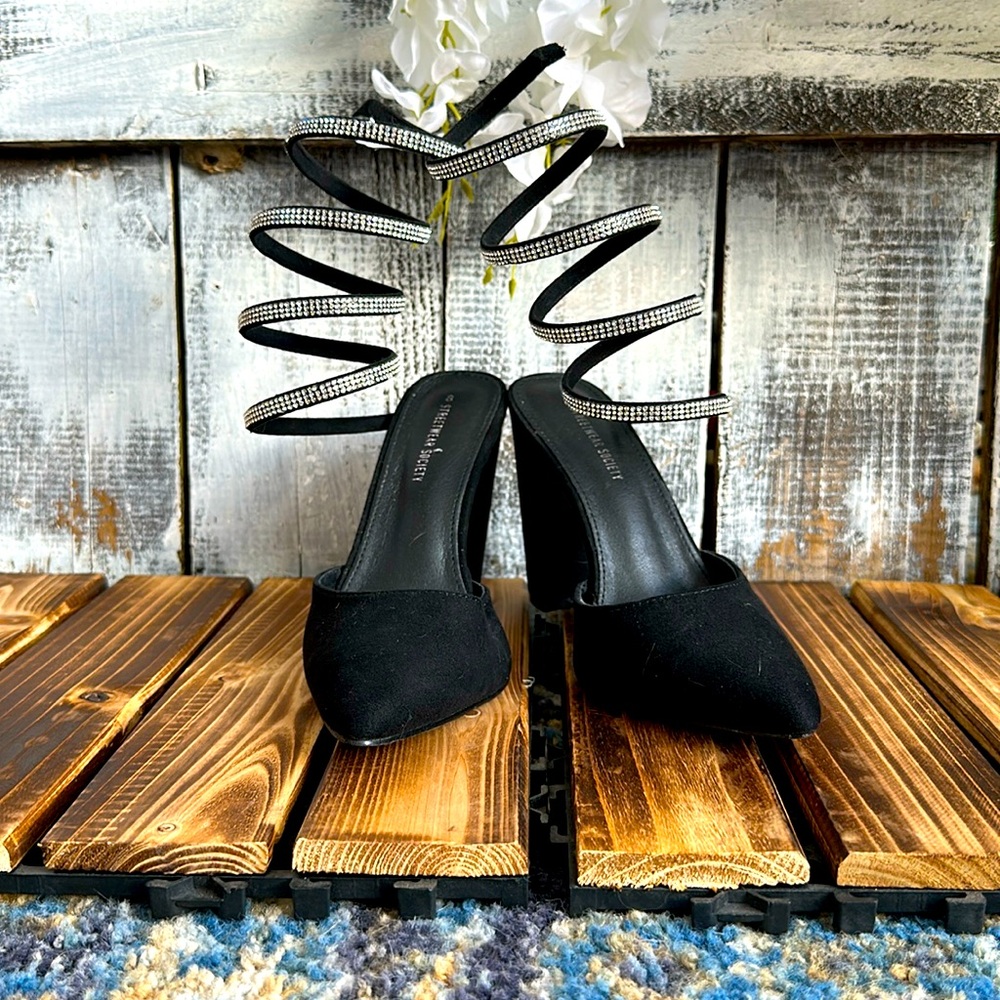Black heels with diamond lacing.